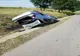 Autoturism răsturnat după un impact cu un autotren
